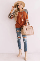 Leopard long sleeve waffle knit orange blouse with twist knot